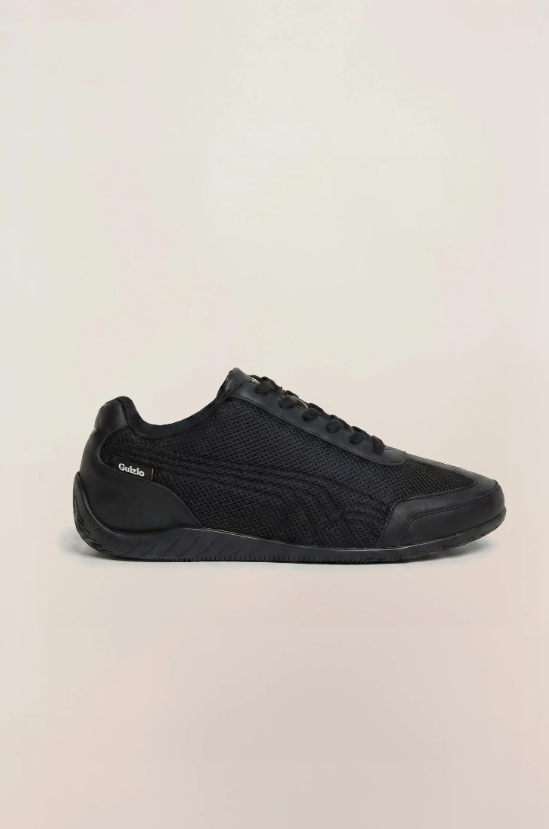 PUMA Low-Profile Sneakers – All Black with Mesh-Textured Panels