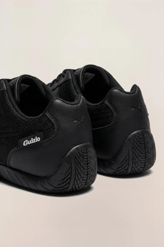 PUMA Low-Profile Sneakers – All Black with Mesh-Textured Panels