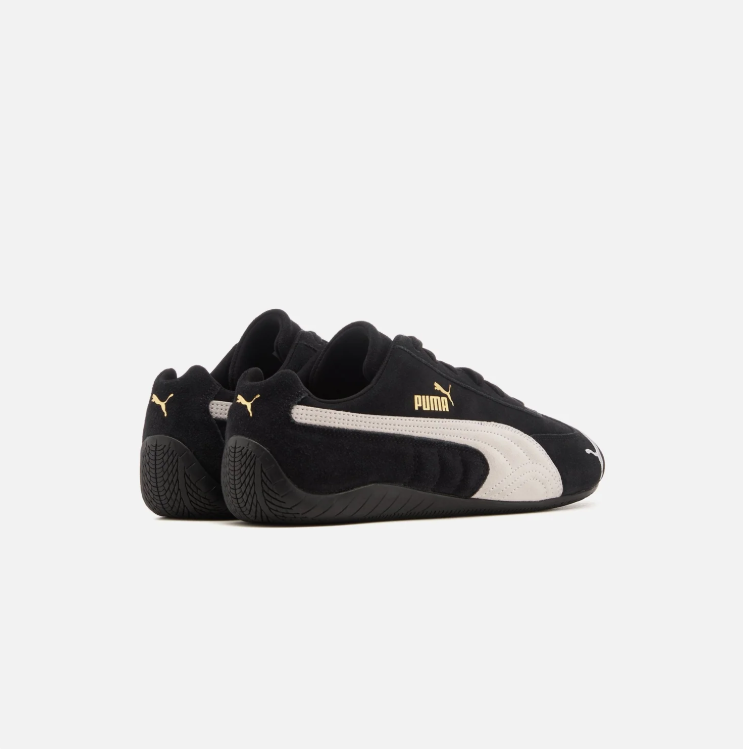 PUMA Low-Profile Sneakers – Black & White with Gold-Tone Branding