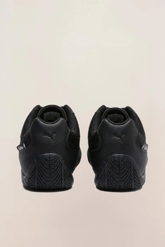 PUMA Low-Profile Sneakers – All Black with Mesh-Textured Panels